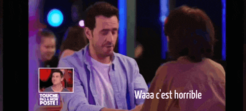 a man talking to a woman with the words waaa c est horrible written on the screen