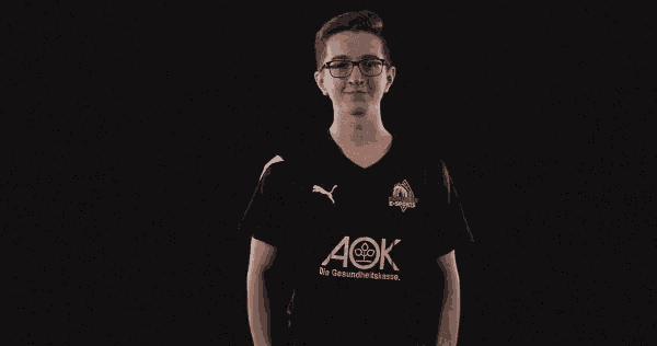 a young man flexes his muscles wearing a black shirt that says ao on it
