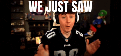 a young man wearing headphones and a philadelphia eagles jersey says we just saw