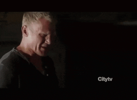 a tv screen shows a room with a door and a sign that says citytv on it