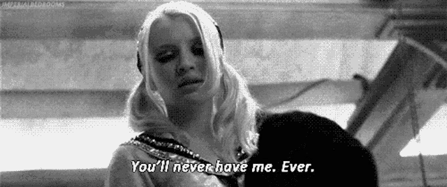 a black and white photo of a woman saying `` you 'll never have me ever . ''