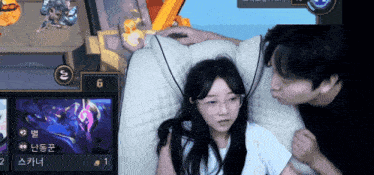 a man kisses a girl while playing a video game with the number 6 in the corner