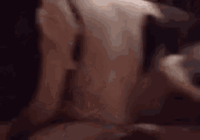 a close up of a person 's face with a knife in their mouth .
