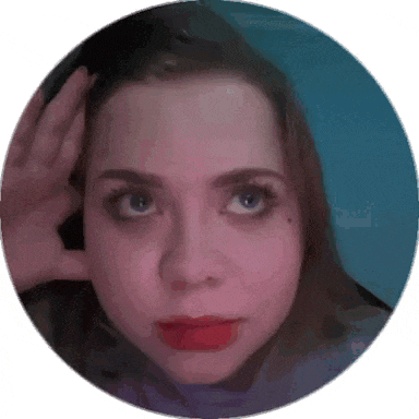 a close up of a woman 's face in a circle with her hand covering her ear