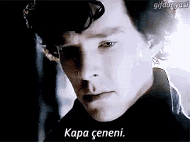 a close up of a man 's face with the words " kapa ceneni " on the bottom