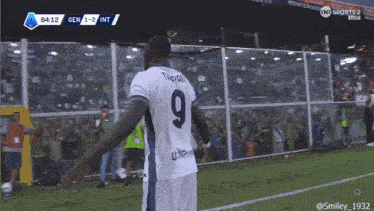 a soccer player with the number 9 on the back of his shirt