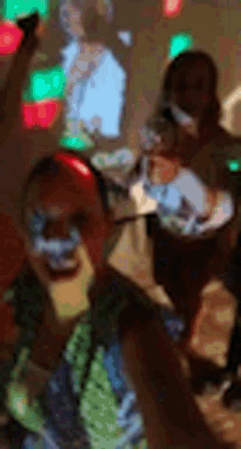 a blurry picture of a group of people sitting at a table .