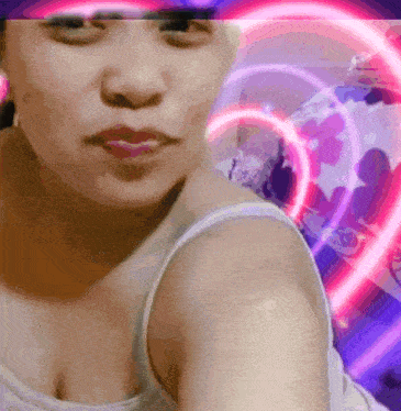 a close up of a woman 's face with a pink heart behind her