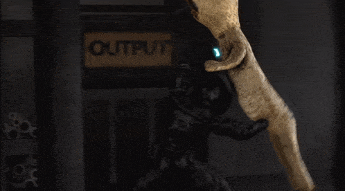 a blurred image of a person standing in front of a sign that says ' outfits ' on it