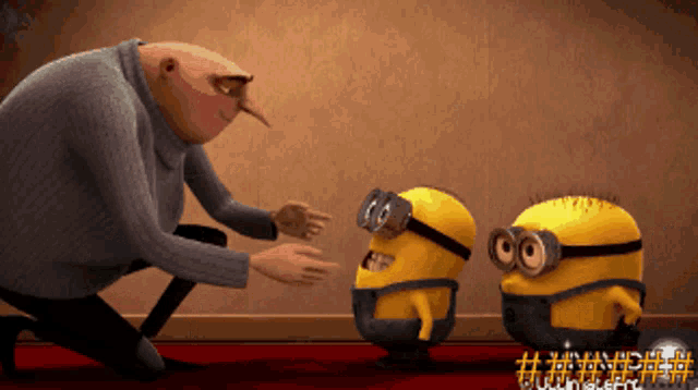 a man kneeling down with two minions in front of a sign that says # despicable me