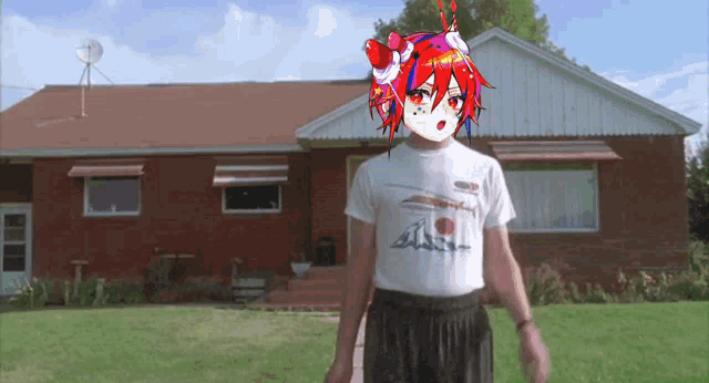 a man standing in front of a brick house wearing a t-shirt with a picture of a girl with red hair