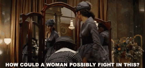 a woman is looking at her reflection in a mirror with the words how could a woman possibly fight in this