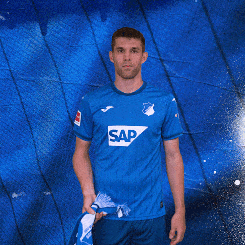 a man in a blue shirt with the word sap on the front