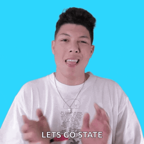 a young man wearing a white shirt that says lets go state