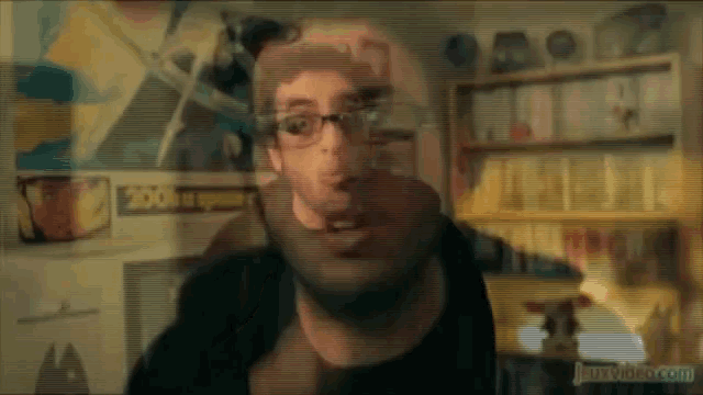 a blurred image of a man with glasses and a sign that says zoo