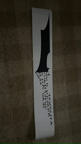 a piece of paper with the number 1 on it is hanging on the wall