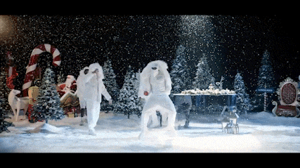 a group of people dancing in a snowy scene