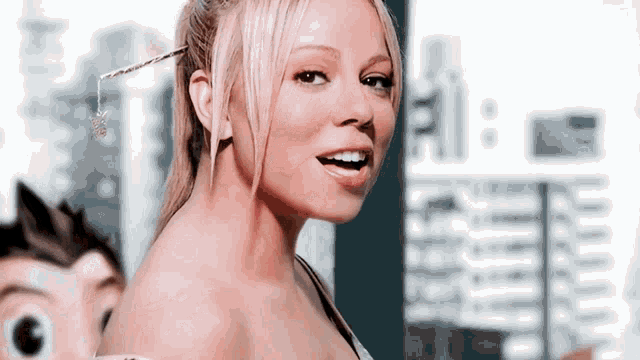 a close up of a woman with a ponytail