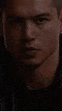 a close up of a man 's face with a lightning bolt coming out of it