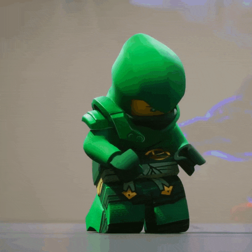 a green lego ninjago character with a hood