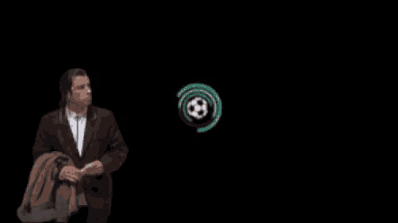 a man in a suit is standing in front of a soccer ball in a circle .