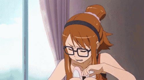 a girl wearing glasses and a headband is looking down