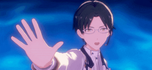 a man with glasses is reaching out his hand towards the camera .
