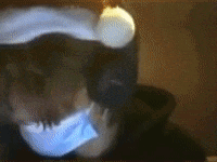 a blurry picture of a person wearing a mask and a hat