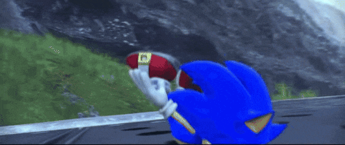 sonic the hedgehog and shadow the hedgehog are playing a video game and sonic is laying on the ground .