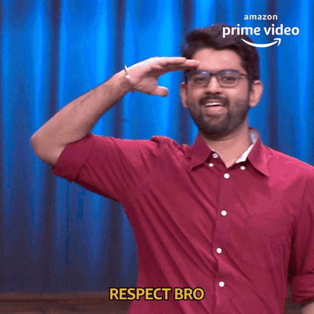 a man wearing glasses and a red shirt says respect bro in front of an amazon prime video logo