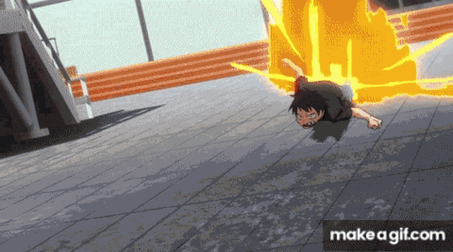 a person is laying on the ground with a fire coming out of their back .