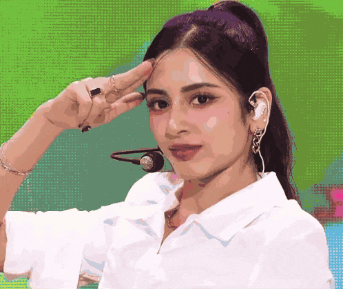 a pixelated image of a woman wearing a white shirt