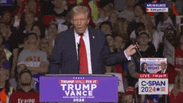 donald trump is giving a speech at a podium that says trump will fix it trump vance