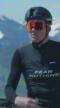 a man wearing a black shirt that says fear nothing on it