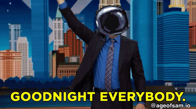 a man in a suit says goodnight everybody in front of a city skyline