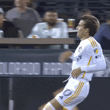 a soccer player wearing a jersey that says ' ttv ' on the arm