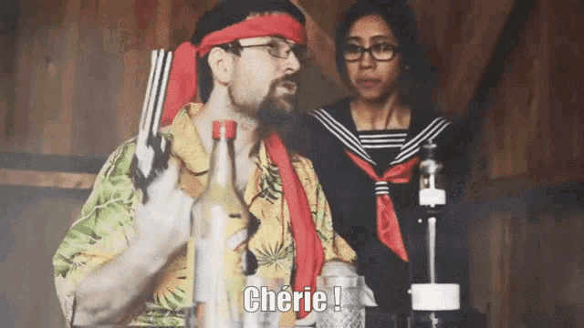 a man in a hawaiian shirt is holding a gun and says cherie in front of a woman