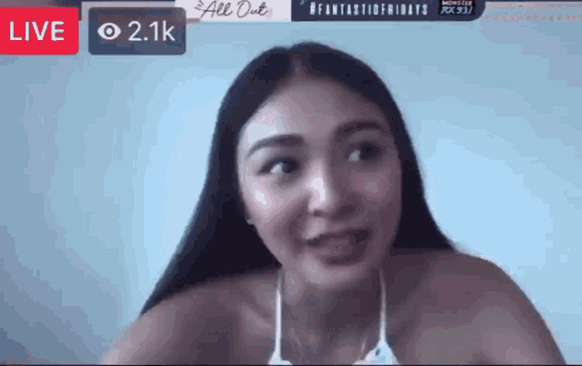 a woman in a bikini is talking on a live stream ..