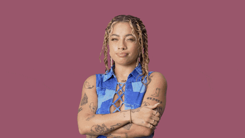 a woman with a tattoo on her arm that says ' socks '