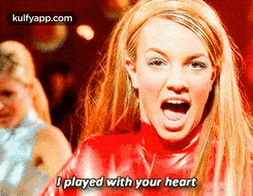 britney spears is singing i played with your heart in a video .