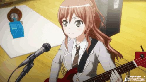 a girl is playing a guitar in front of a microphone with the word band around her neck