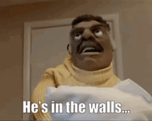 a man with a mustache is holding a roll of toilet paper .