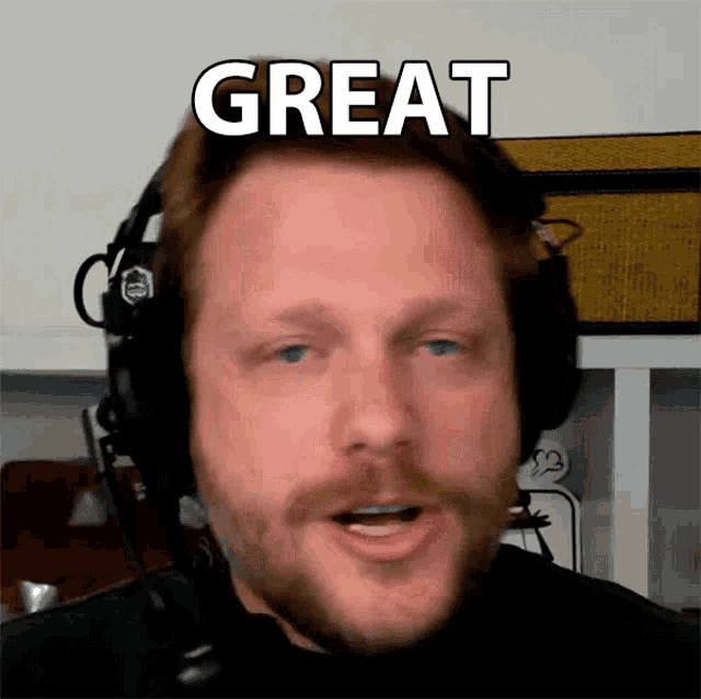 a man wearing headphones with the word great written on his face