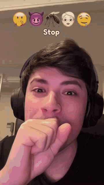 a man wearing headphones has a mosquito and a devil emoji behind him