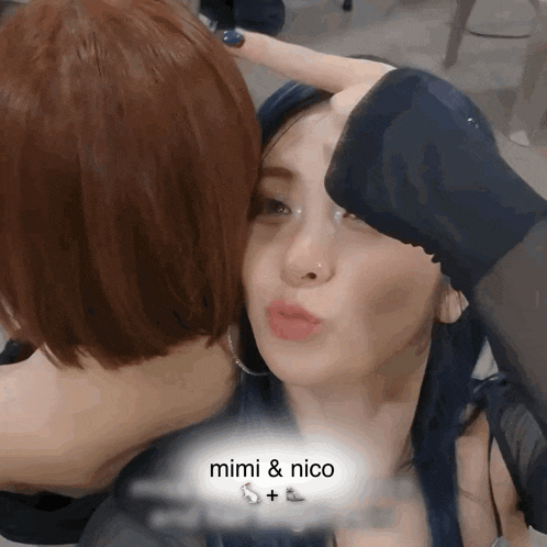 a woman kissing another woman 's forehead with the words mimi & nico on the bottom right