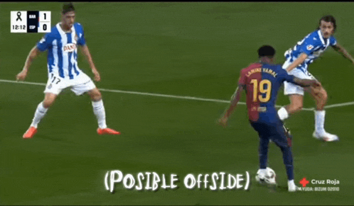 a soccer player wearing a number 19 jersey kicks the ball