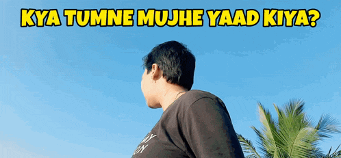 a man stands in front of a blue sky with the words kya tumne mujh e yaad kiya