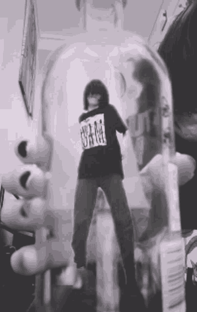 a person wearing a black shirt that says uhm