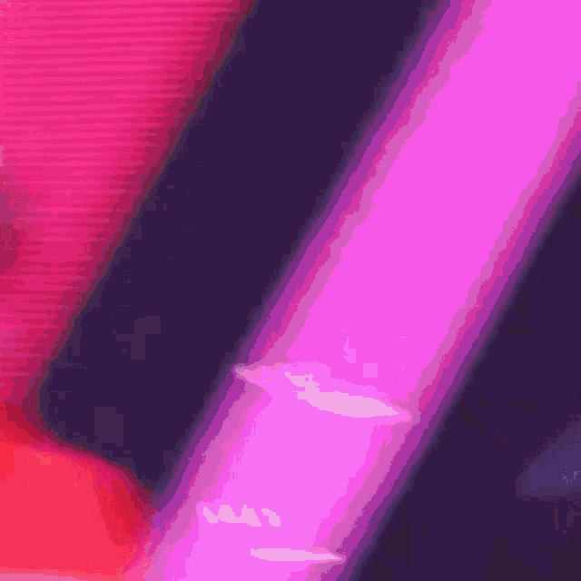 a close up of a purple light with a red background
