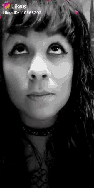 a black and white photo of a woman 's face with the likee id 110565302